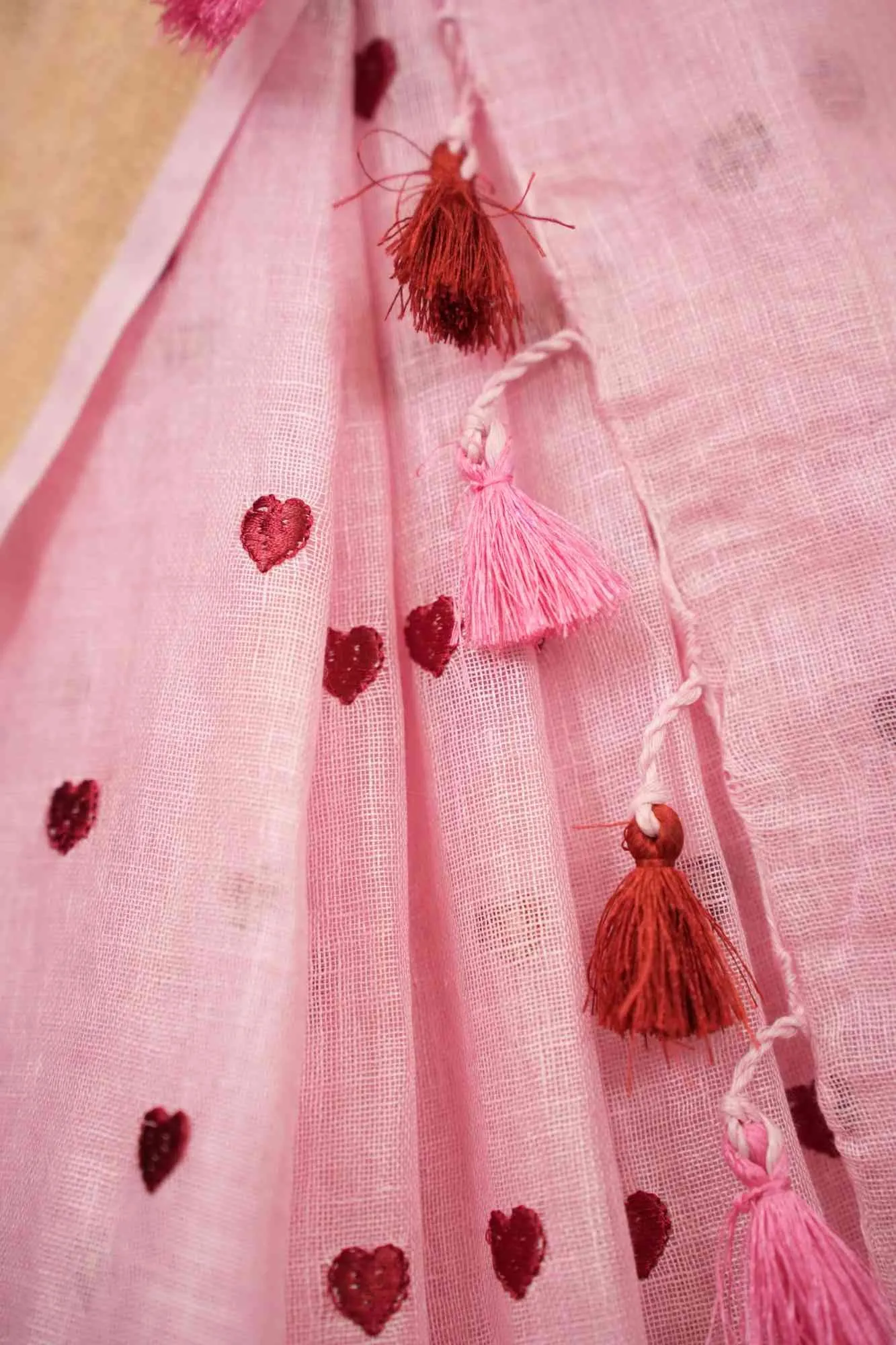 Beautiful  Pink Linen Heart Embroidered & Solid Border With Tassels On Palla Pre Drape Saree